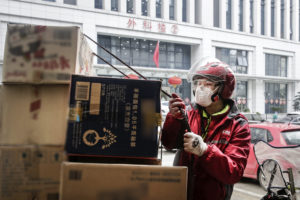 JD couriers, our heroes in red delivering trust across the city of Wuhan