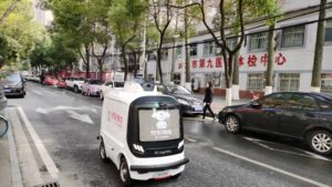 JD autonomous delivery robot on road in Wuhan