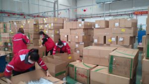 JD staff at a warehouse in Guangzhou sort medical products procured in China for Indonesian initiative Relawan Anak Bangsa on April 23.