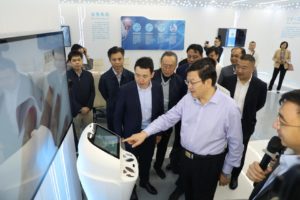 Cai Jinjun, Mayor of Beihai (center), Lijun Xin, CEO of JD Health (thrid from the left) visit the project exhibition center 