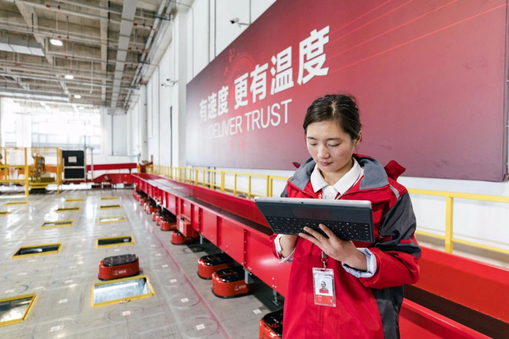 Jiang Shan was among the first employees working as a sorter for JD.com’s first Asia No.1 fulfillment center in Shanghai