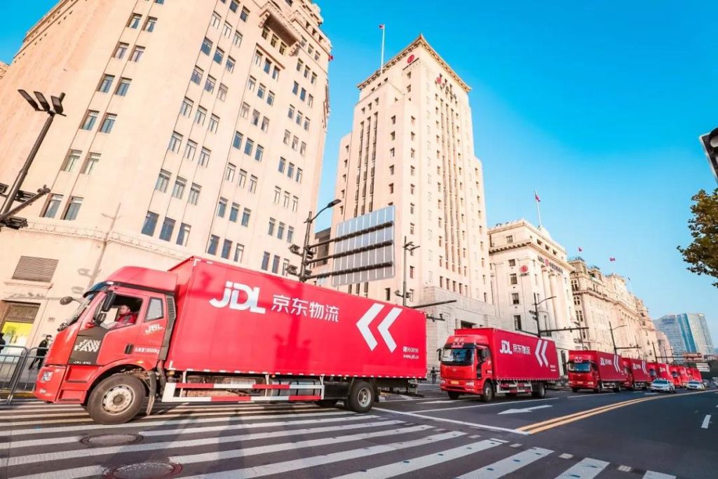 JD trucks transporting supplies