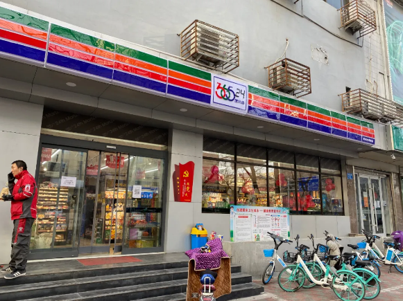 Zhou eating breakfast outside a convenience store in Shijiazhuang